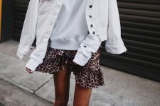 37 a white sweatshirt, a leopard mini skirt, a denim jacket, black trainers and layered necklaces