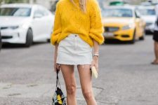 43 a bright fall outfit with a white denim mini, a bold yellow oversized sweater, printed flats and a printed floral bag