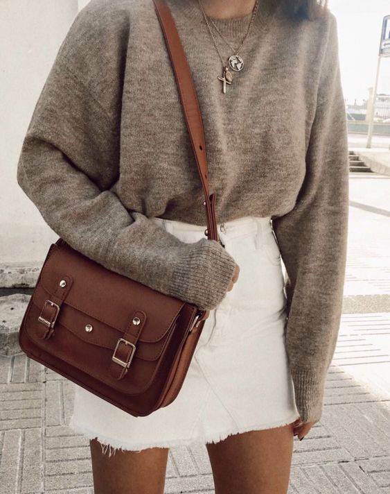 a grey oversized jumper, a white denim mini skirt, a brown bag and layered necklaces are a great idea for the fall