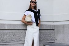 46 a minimalist outfit with a white t-shirt, a white denim maxi, a black jumper, a neutral bag and black flipflops