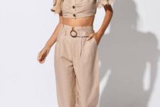 With beige puff sleeved crop button down shirt and black ankle strap low heeled shoes