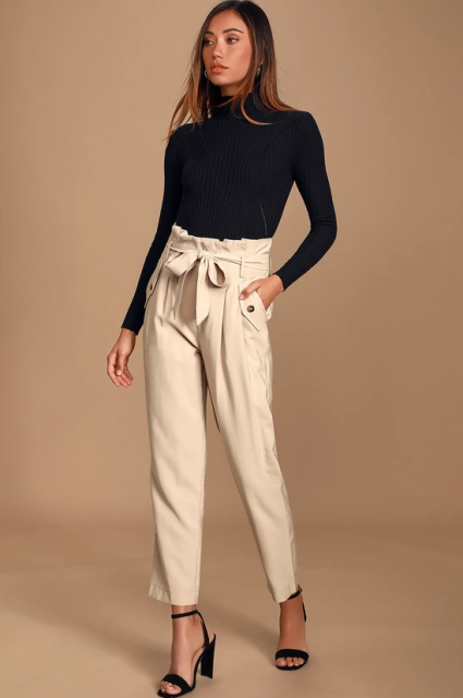 With black fitted turtleneck, earrings and black ankle strap high heeled shoes