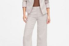 With brown fitted top, beige linen culottes and snake printed low heeled mules