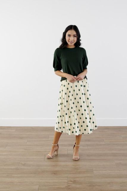 With emerald green loose puff sleeved shirt and beige leather ankle strap high heels