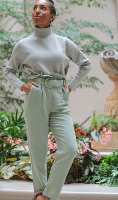 With light gray loose turtleneck and snake printed ankle strap shoes