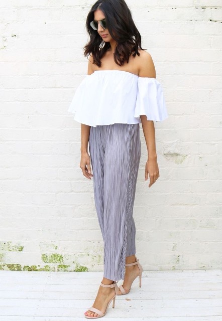 With oversized sunglasses, white off the shoulder ruffled blouse and beige leather ankle strap high heels