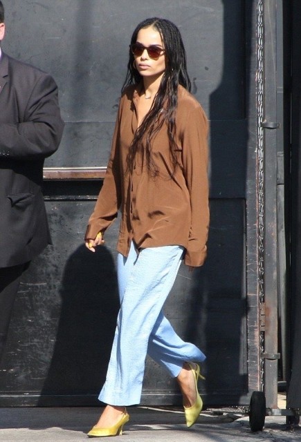With sunglasses, light blue loose pants and light green low heeled shoes