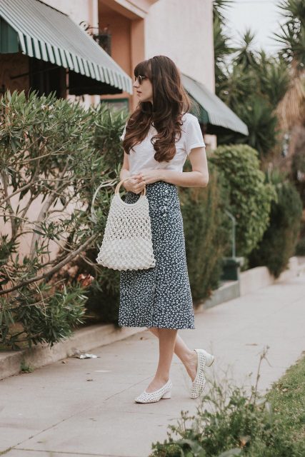 With sunglasses, white t-shirt, white fishnet bag and white low heeled shoes