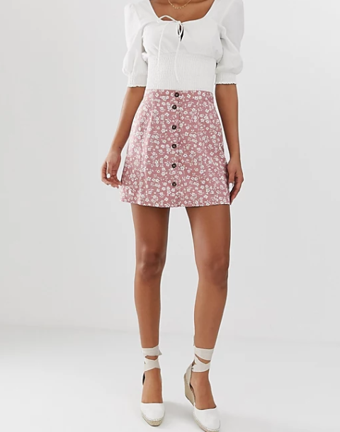 With white blouse and white lace up heeled shoes