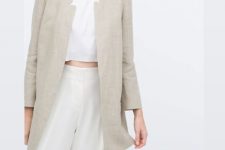 With white crop top and beige high-waisted pants