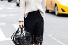 With white loose sweater, necklace, transparent bag and beige shoes