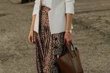 With white t-shirt, white loose blazer, brown leather bag and white sneakers