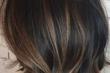 a black bob with caramel balayage and babylights is amazing and looks voluminous