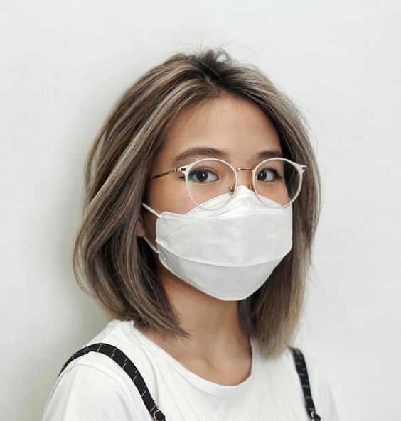 a brown long bob with ashy blonde balayage and a lot of volume looks amazing