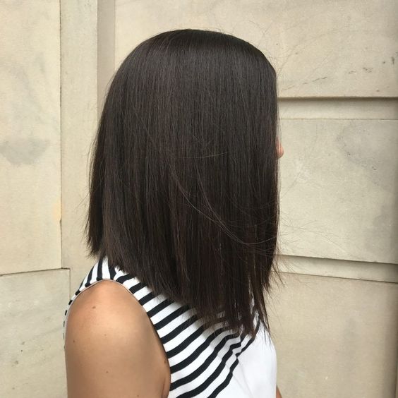 a chic black A-line long bob is always a good idea, give it a bit of volume and highlight this sloped line