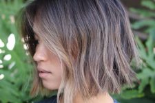 a choppy bob with darker root and bronde and blonde balayage, with texture and volume looks fresh and cool