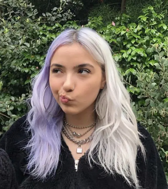 a creative split dye hairstyle with an icy blonde and lilac half plus a bit of texture is a cool idea