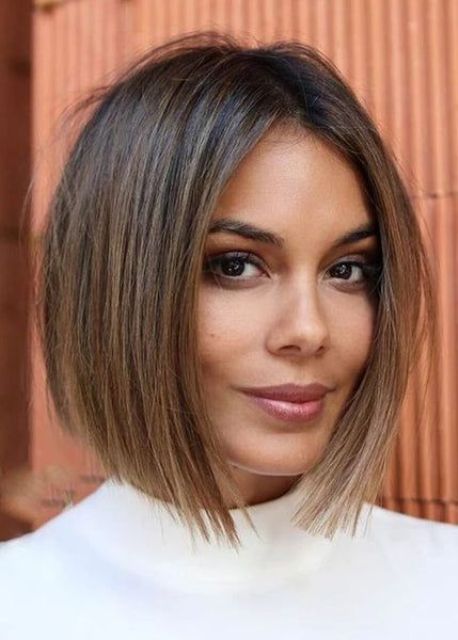 a dark brown short bob with bronde balayage to make the look more eye catchy and bold