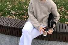 a white top and white jeans, neutral trainers, a greige sweater and a black bag with chain for the fall
