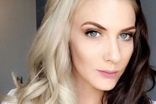 bold split dyed hair – dark brunette plus icy blonde, waves and a ponytail is a lovely idea that rocks