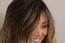 dark brown, almost black hair with bronde and caramel waves and a money piece is a lovely idea for a sunkissed look