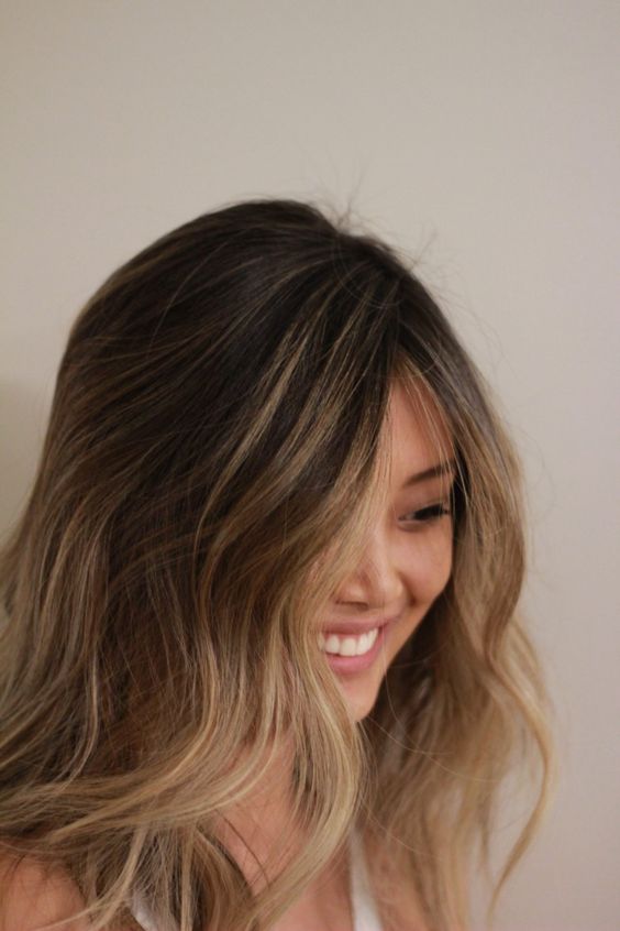 dark brown, almost black hair with bronde and caramel waves and a money piece is a lovely idea for a sunkissed look