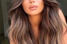 dark brown hair with bronde and caramel balayage and waves is a lovely solution for a dimensional and beahcy look