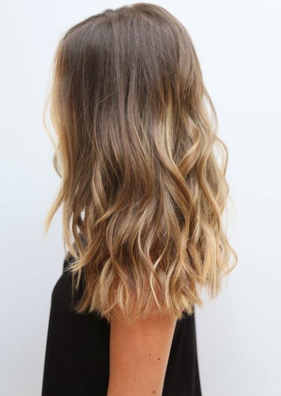 light brunette hair with beautiful sunkissed touches as if they are totally natural and are made by the sun