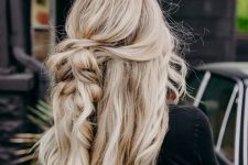 long and beautiful beach blonde hair with twists, braids and waves down plus volume and a texture created with sea salt spray