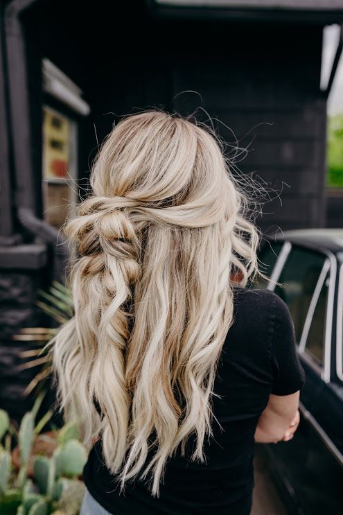 long and beautiful beach blonde hair with twists, braids and waves down plus volume and a texture created with sea salt spray