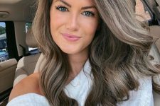 long and wavy mousy brown hair with much volume is always a good and very subtle idea to rock