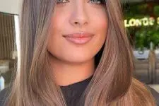 long mousy brown hair with blonde babylights and a bit of volume is a lovely idea for a modern and fresh look