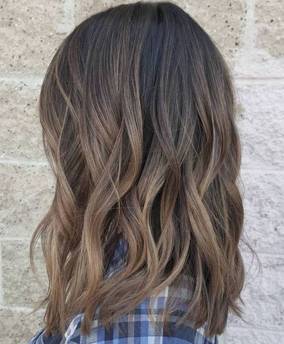 this subtle version lets natural brunettes ramp up their signature shade. The dark chocolate base is given a multi-dimensional look