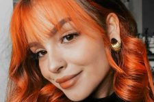two-tone hair – black and bold orange around the face plus orange wispy fringe and waves is a unique idea that wows
