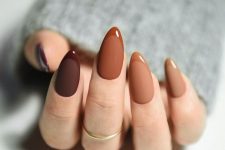 03 a catchy take on mismatching nails – shades of rust and brown done with a matte finish and with glossy tips