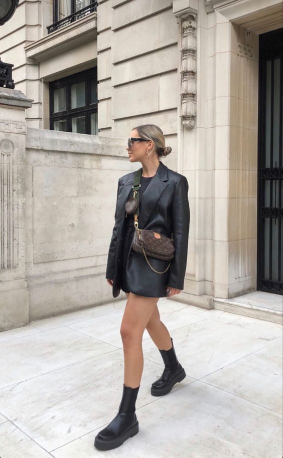 a black t-shirtdress, a black leather blazer, black chunky boots, a brown printed bag for a sexy fall look