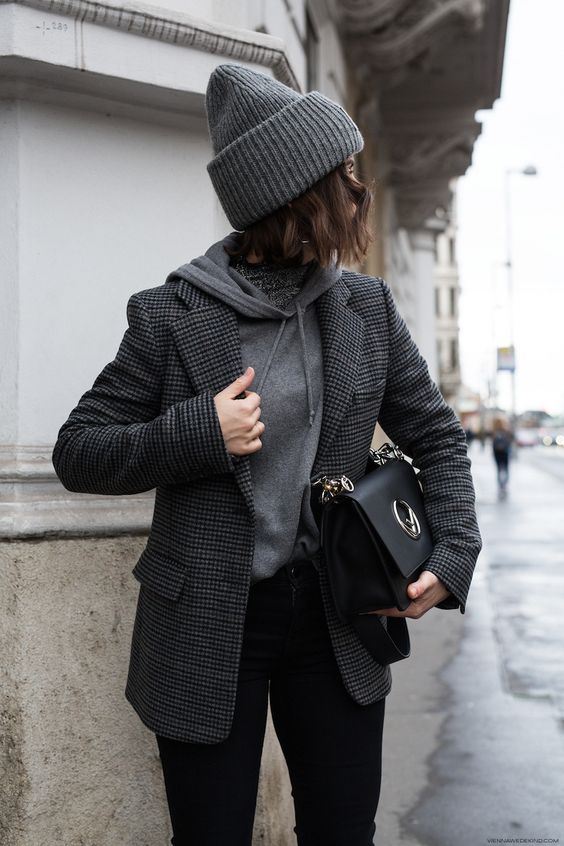 a comfy work look with a grey hoodie, black jeans, a dark grey gingham blazer, a dark grey beanie and a black bag