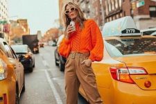 05 a bold orange patterned sweater, beige pants, white slingbacks are a lovely combo for a fall work look