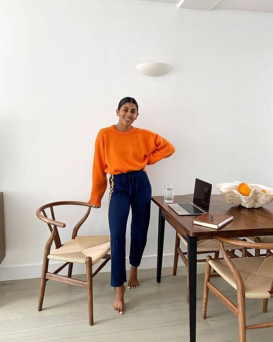 a bright fall outfit with an orange jumper, bold blue pants   add shoes and go
