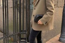 10 a chic outfit with black jeans and chunky boots, an oversized beige blazer and a black t-shirt, a black clutch