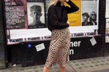 11 a black oversized turtleneck, a leopard slip midi skirt, black combat boots for the fall to winter look