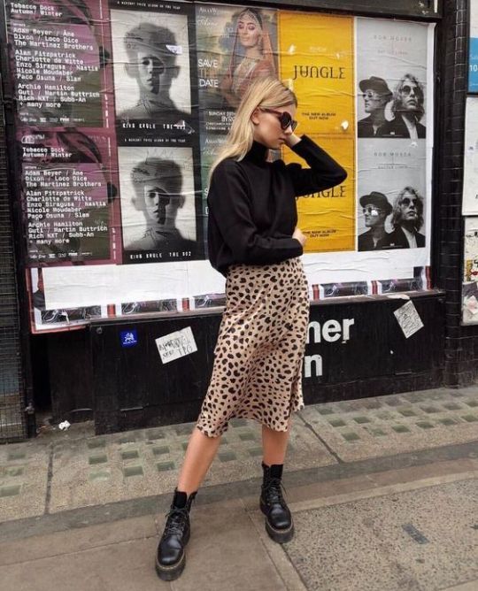 a black oversized turtleneck, a leopard slip midi skirt, black combat boots for the fall to winter look