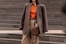 11 a stylish fall work outfit with a white shirt, an orange jumper, beige pants, a brown blazer, a brown bag and white shoes