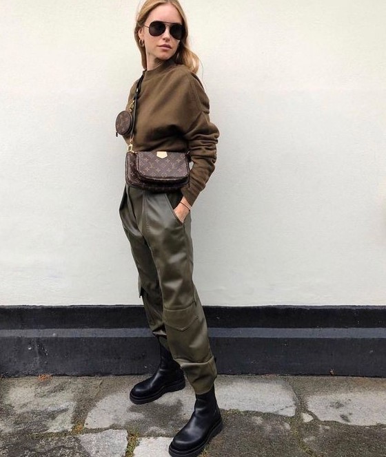 a military inspired look with a brown top, olive green military pants, chunky boots and a simple crossbody