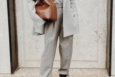 12 a minimalist fall look with a dove grey pantsuit, a matching turtleneck, brown boots and a matching bag is chic
