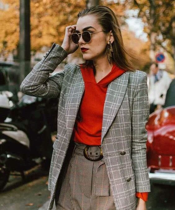 a bright and chic fall work look with a grey plaid pantsuit, a red hoodie, red loafer shoes and a bold bag