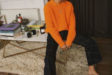 14 an orange jumper, black striped pants and a necklace are a perfect combo for the fall
