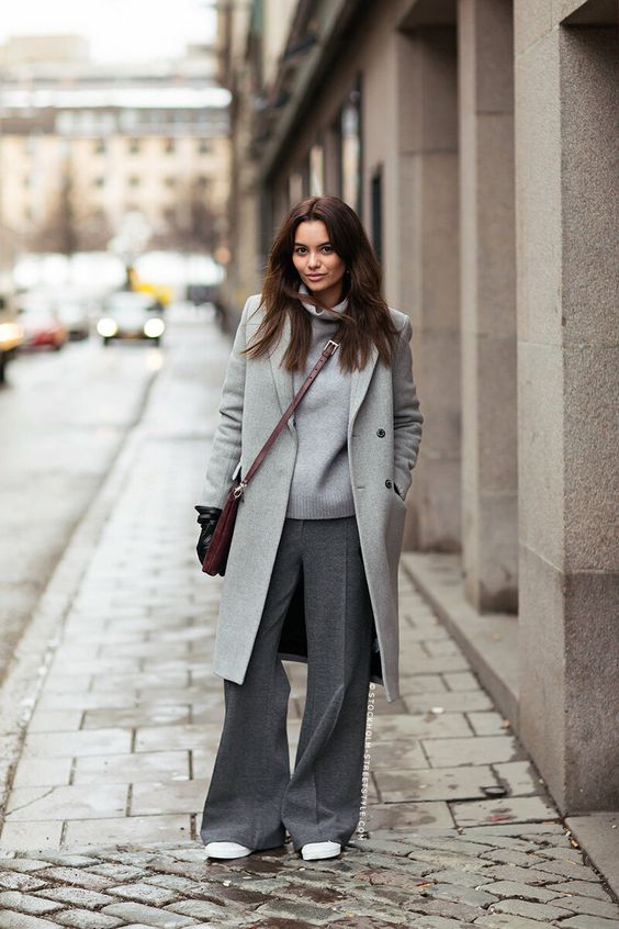 a cozy grey fall outfit with a jumper, wideleg pants, a coat, white sneakers and a burgundy bag