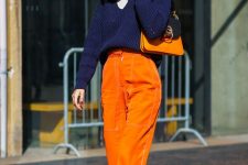 17 a catchy fall outfit with a white t-shirt, a navy sweater, orange pants, a two tone bag and nude shoes
