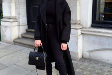 17 a total black fall look with a turtleneck, skinnies, chunky boots, a midi coat and a bag is a timeless idea